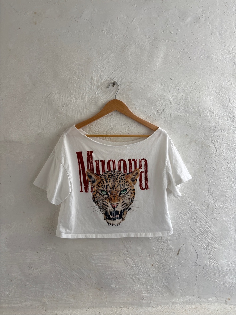 Woman’s white off-the-shoulder graphic t-shirt